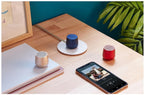 Mini enceinte Bluetooth design galet aluminium — recharge Qi/USB-C, TWS stéréo, micro mains-libres